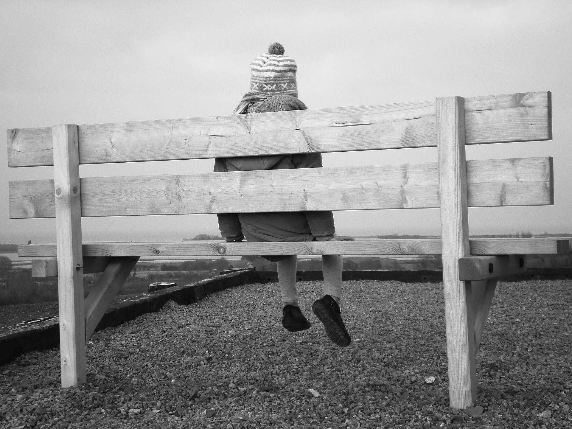 picture of child sitting on bench